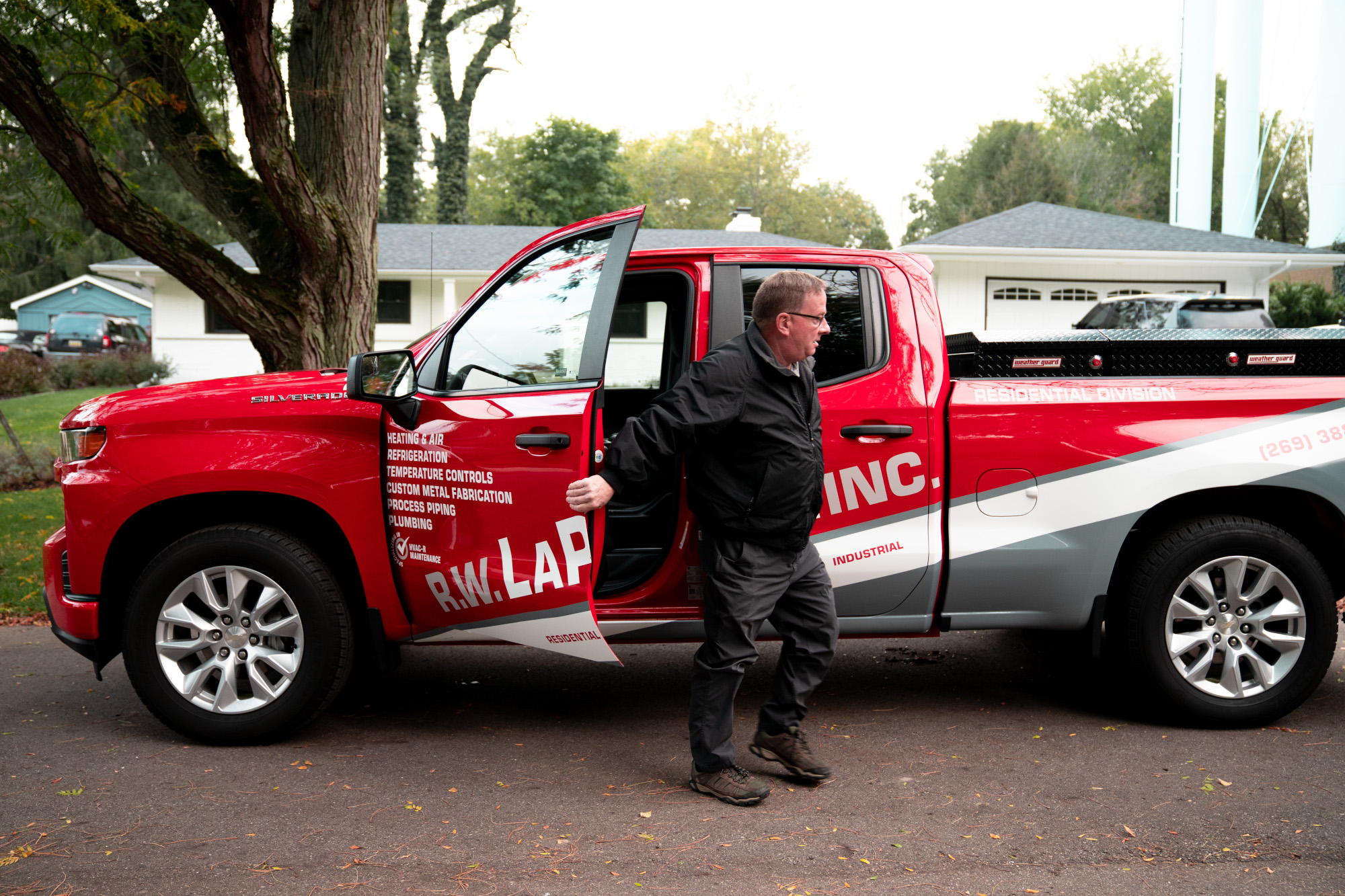 An HVAC technician from R.W. LaPine arrives to diagnose a humid house.
